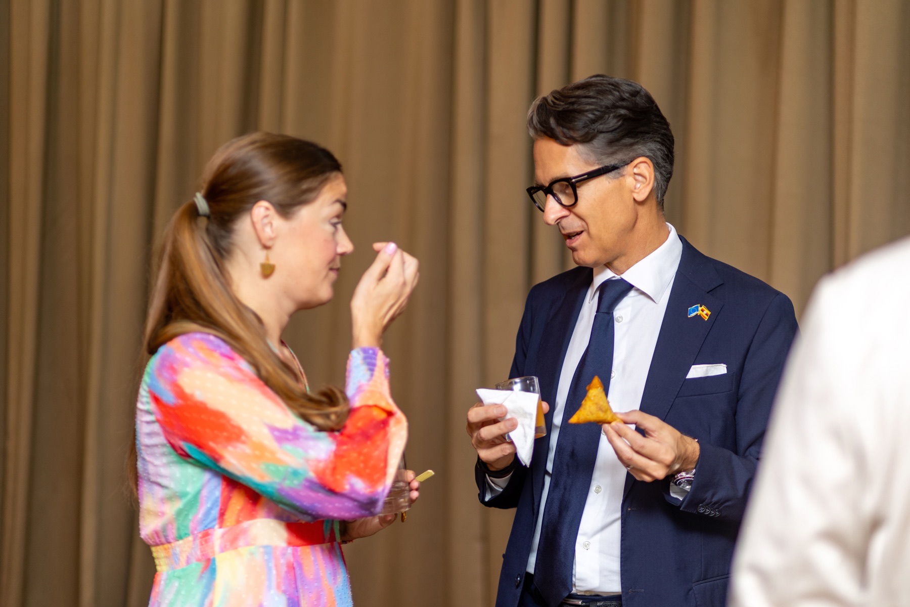 International business delegates networking during a conference break
