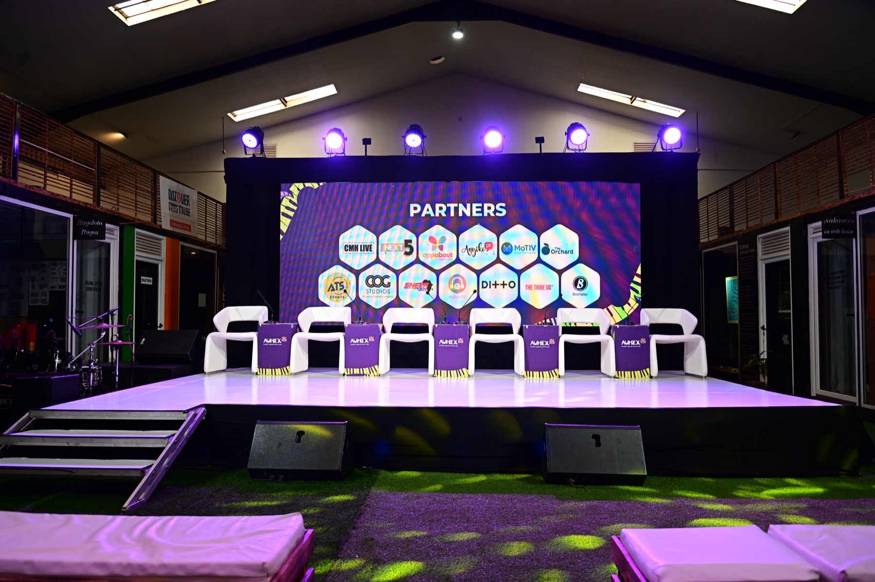 Partner showcase stage prepared with LED screen and panel seating
