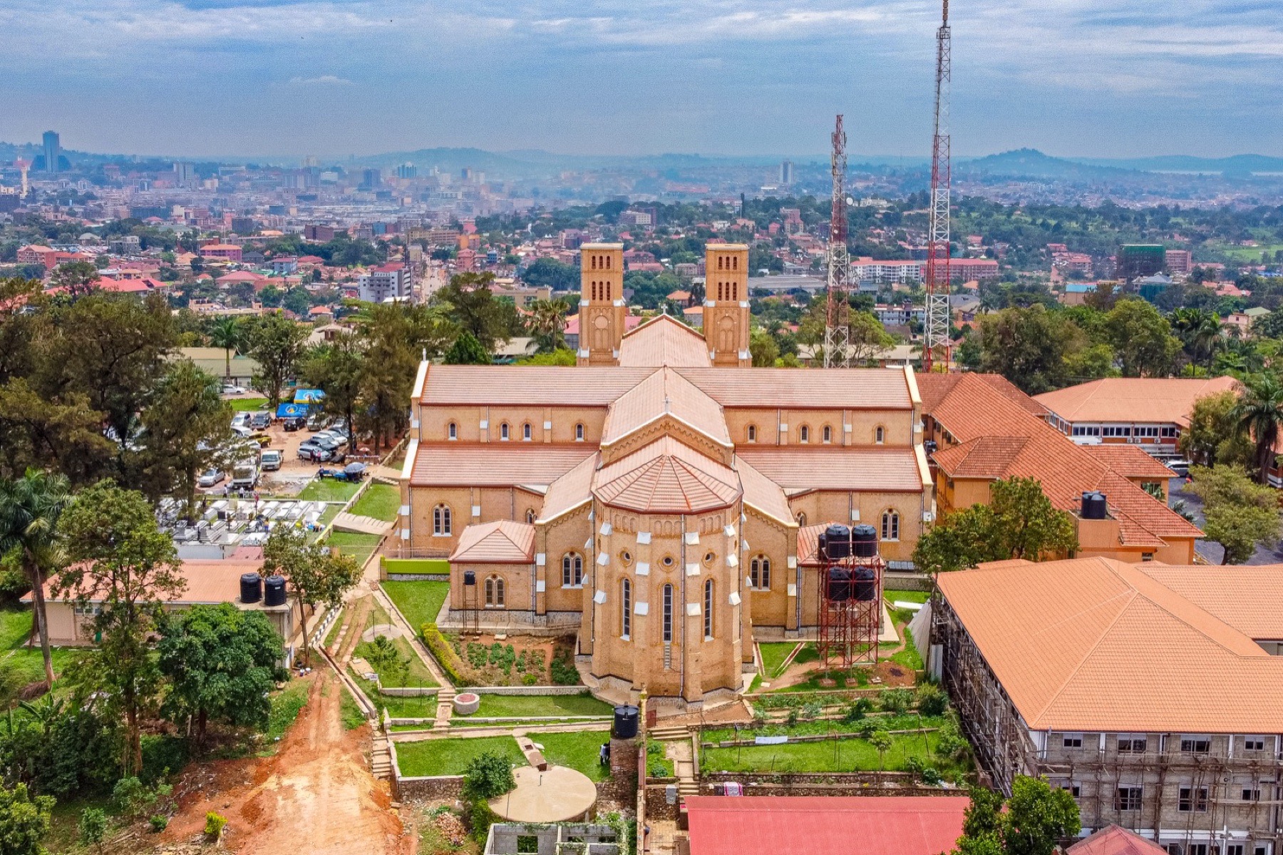 Aerial view of a Kampala brick church and surrounding city