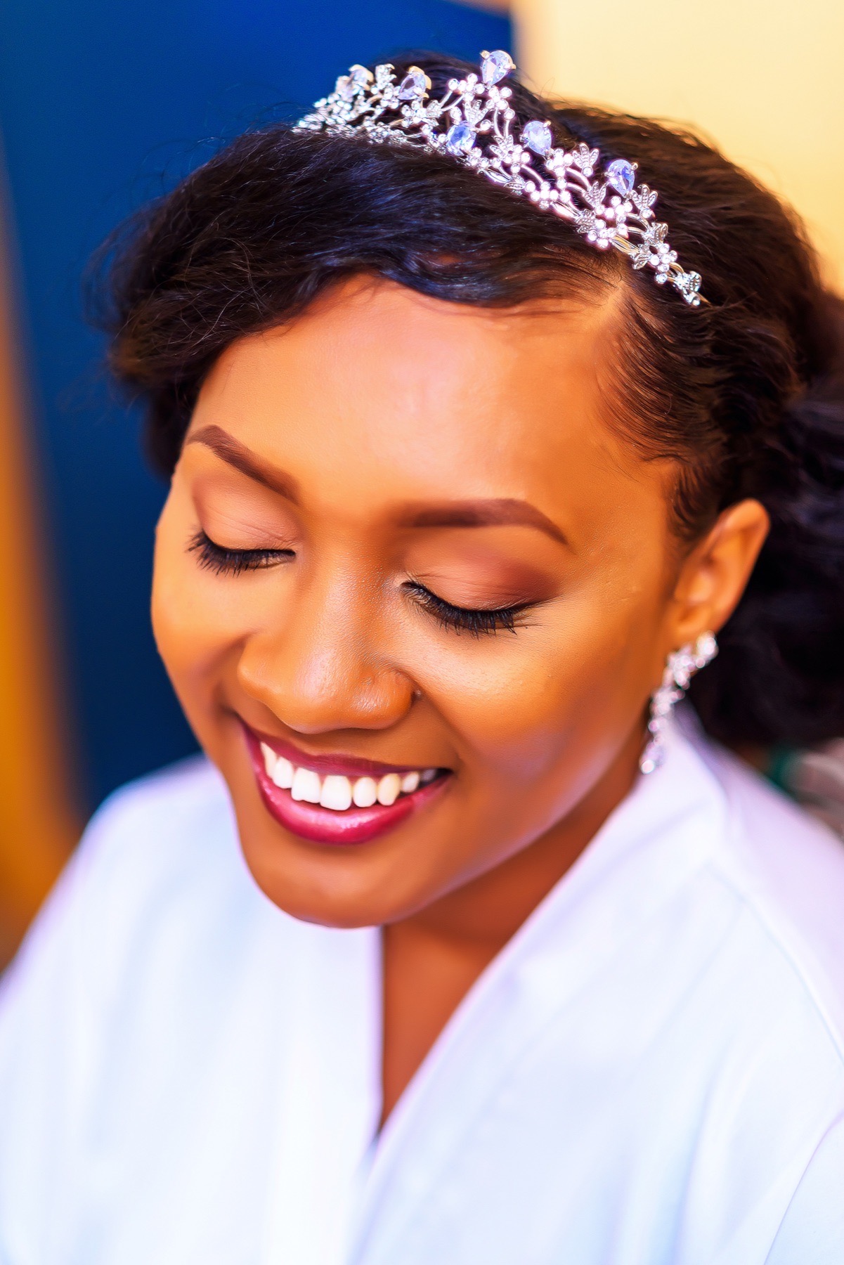 Close portrait of a smiling bride wearing a tiara